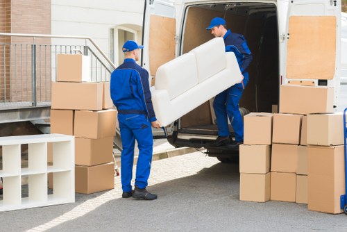 Office equipment and desks being moved during a local commercial move