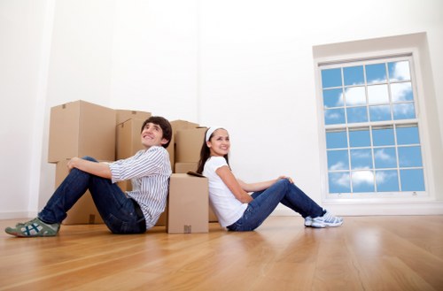Moving boxes and household items with a van in Tooting