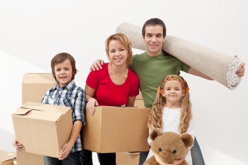 Removal team preparing a flat move in Tooting with boxes and furniture