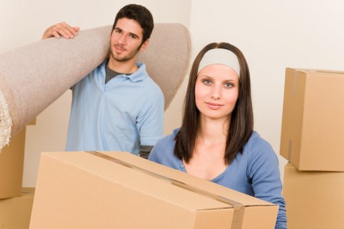 Careful wrapping of fragile household items for a move in Tooting