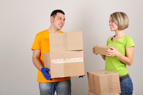 Packed boxes and furniture prepared for a home move in Tooting