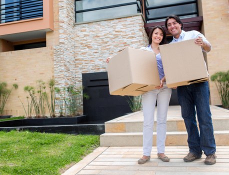 Careful carrying of furniture through a Tooting flat stairwell